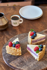 Cheesecake with berries on a wooden background. Side view.