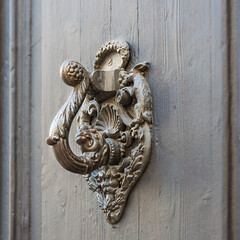 Antique handle on the museum door in Sitges, a city in Spain