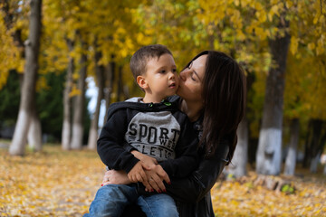 Fototapeta premium Mother and baby love on autumn sunny day