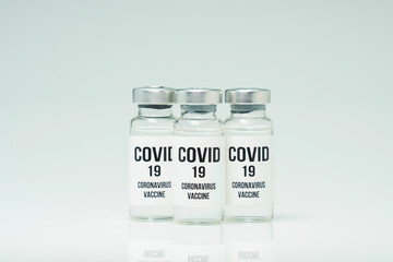 Covid 19 coronavirus vaccine in glass flask for immunity