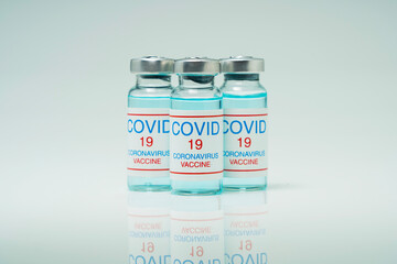 Covid 19 coronavirus vaccine in glass flask for immunity