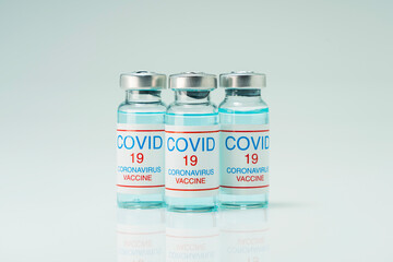 Covid 19 coronavirus vaccine in glass flask for immunity