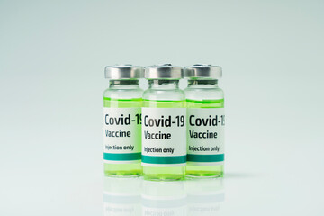 Covid 19 coronavirus vaccine in glass flask for immunity