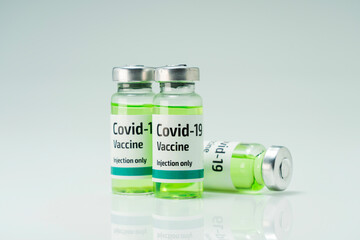 Covid 19 coronavirus vaccine in glass flask for immunity