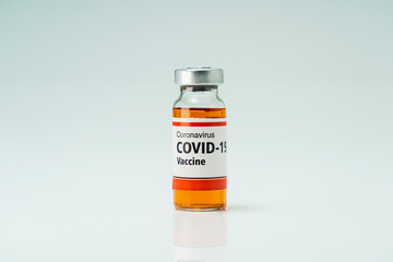 Covid 19 coronavirus vaccine in glass flask for immunity