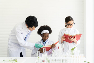 Asian man scientists and diversity children doing tests of plants in classroom. Group of diversity scientists learning science and doing analysis for germs and bacteria with microscope and glassware