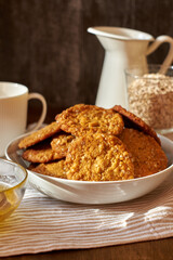 Honey oatmeal chip cookies. Side view. Milk.