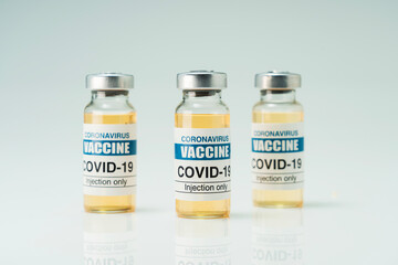 Covid 19 coronavirus vaccine in glass flask for immunity