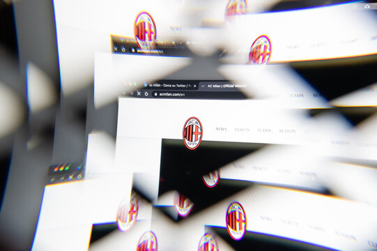 Milan, Italy - APRIL 10, 2021: ac milan logo on laptop screen seen through an optical prism. Dynamic and unique image from ac milan website. Illustrative editorial.