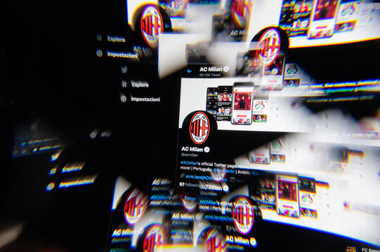 Milan, Italy - APRIL 10, 2021: ac milan logo on laptop screen seen through an optical prism. Dynamic and unique image from ac milan website. Illustrative editorial.