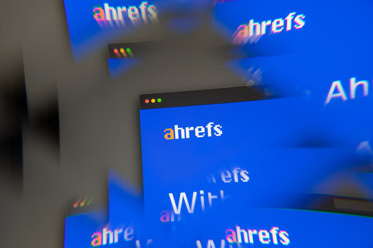 Milan, Italy - APRIL 10, 2021: Ahrefs logo on laptop screen seen through an optical prism. Dynamic and unique image from Ahrefs website. Illustrative editorial.