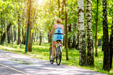 Fototapeta premium Cyclist ride on the bike path in the city Park 