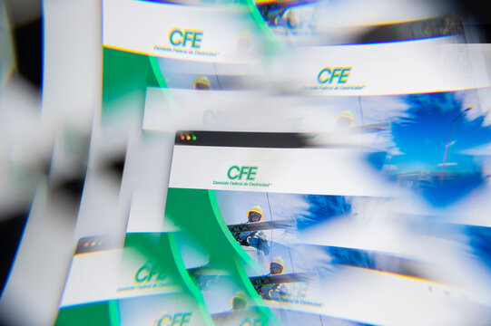 Milan, Italy - APRIL 10, 2021: CFE logo on laptop screen seen through an optical prism. Illustrative editorial image from CFE website.