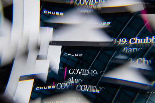 Milan, Italy - APRIL 10, 2021: Chubb logo on laptop screen seen through an optical prism. Illustrative editorial image from Chubb website.
