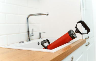 Professional force pump cleaner in the kitchen sink.