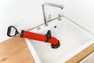 Professional force pump cleaner in the kitchen sink.