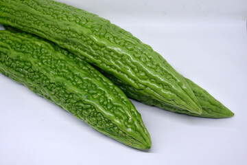 Green Pare Fruit: Pare is known to have a bitter taste when it is young and green. Close up of Pare Hijau which is sold in traditional market