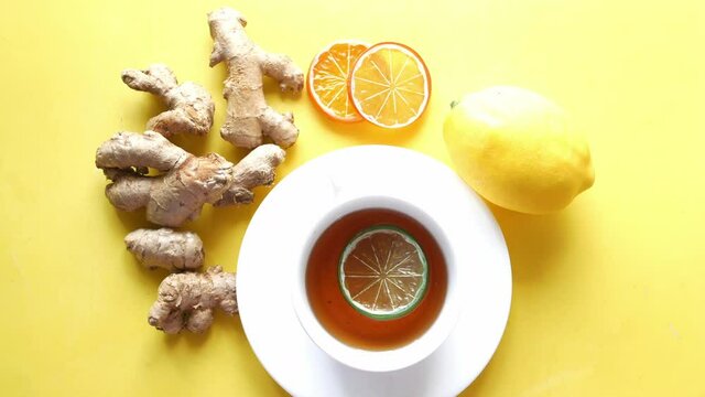 Top view of ginger tea on wooden background.