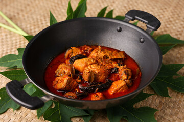 Spicy King fish curry gravy , hand cooking spicy Kerala fish curry fish vindaloo , Goan red fish curry , Indian fish curry Bengali fish masala curry Kolkata, Tamil Nadu India Sri Lanka. Lankan food