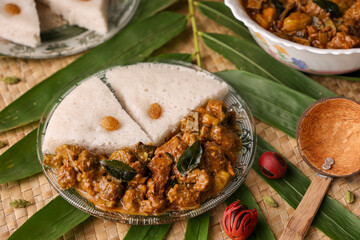 Spicy beef curry and appam Goan style beef vindaloo. Traditional Indian Lamb. beef and kaya curry gravy popular in Kerala Goa India Sri Lanka for Parotta porotta . Chukhandar gosht. Lankan food
