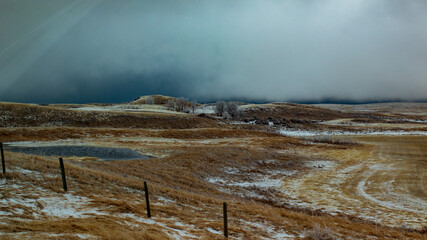 Dark clouds over a farmers field, a spring storm in the prairies