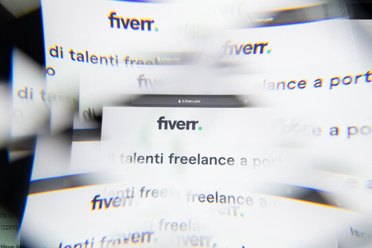 Milan, Italy - APRIL 10, 2021: fiverr logo on laptop screen seen through an optical prism. Illustrative editorial image from fiverr website.