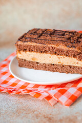 piece of chocolate cake with mousse cream sweet dessert vanilla cocoa cinnamon snack trend meal copy space food background rustic. top view