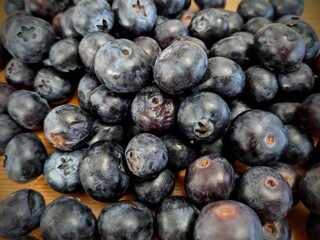A lot of ripe and natural blueberries, healthy and organic food. Background of fresh blueberries. Top view.