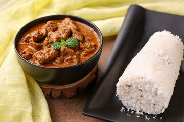 Beef curry and White rice Puttu, Pittu south Indian breakfast with meat curry mutton curry Kerala...