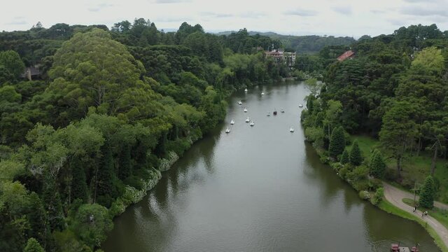 aerial image with drone mavic 2 pro from Lago Negro in Gramado Rio Grande do sul Brazil with pedal boats and trees around