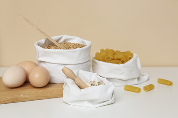 Organic eggs, pasta and wheat grains in reusable textile bag. Plastic free delivery from bulk store. Suistainable and zero waste food shopping. 