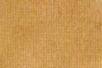 Yellow fabric, woven texture close-up, jute, canvas. Abstract pattern for background, copy space