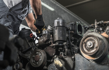 Diesel Specialist Automotive Mechanic Repairs the Engine