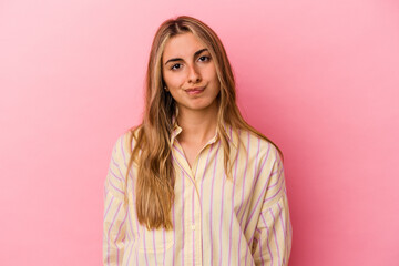 Fototapeta premium Young blonde caucasian woman isolated on pink background sad, serious face, feeling miserable and displeased.