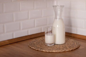 Happy Day of Milk. Milk jug and glass on light background