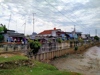 Kali BKB Season City, Jakarta, Indonesia - (4-4-2021) : slum housing in a riverside area