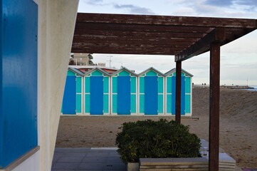 Colorful beach cabins in front of the Adriatic Sea at sunrise (Pesaro, Italy, Europe)
