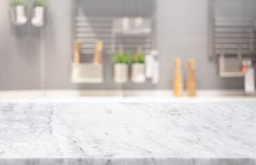 Selective focus,Marble table top on blur white kitchen room background.F