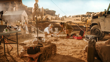 Archaeological Digging Site: Two Great Archeologists Work on Excavation Site, Cleaning Cultural...