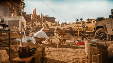 Archaeological Digging Site: Two Great Archeologists Work on Excavation Site, Carefully Cleaning,...