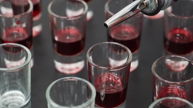 Alcohol cocktail with vodka and grenadine syrup