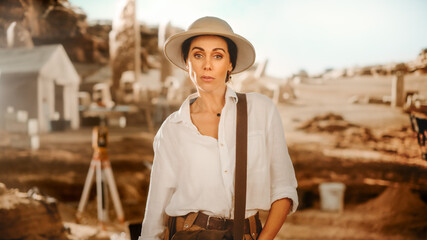Portrait of Beautiful Female Adventurer Posing and Looking at Camera. Stylish Great Archaeologist...