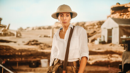 Portrait of Beautiful Female Adventurer Posing and Looking at Camera. Stylish Great Archaeologist...
