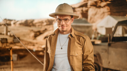 Portrait of Handsome Male Adventurer Posing and Looking at Camera. Stylish Great Archaeologist...
