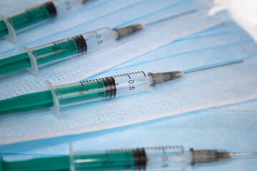 syringe and needle on mask