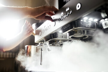 Bartender making coffee barista in a cafe
