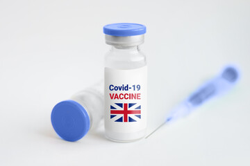 New British Strain Coronavirus Concept. Ampoule with injection from covid-19 on a white background and a syringe