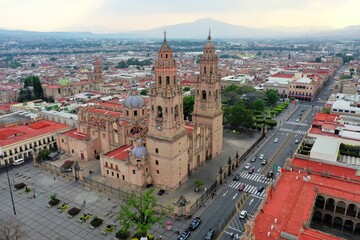 Fototapeta premium Aerial photo of Catedral de Morelia, located at city downtown. Drone photos at sunset of Morelia City.