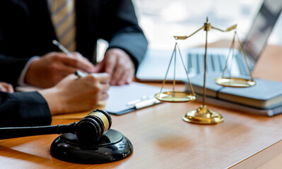 The Lawyer is currently shaking hands with the client about the success in resolving the case.	