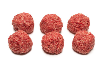 Raw meat balls isolated on white background.
